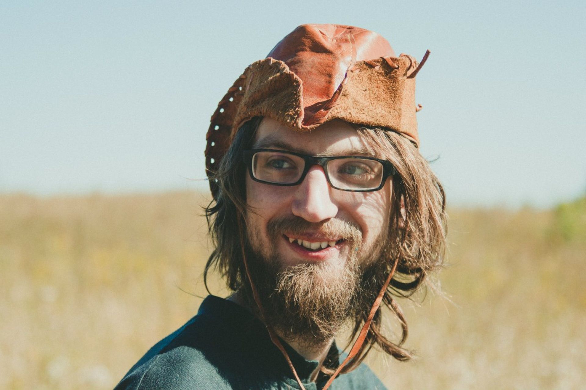 A man wearing a brown hat